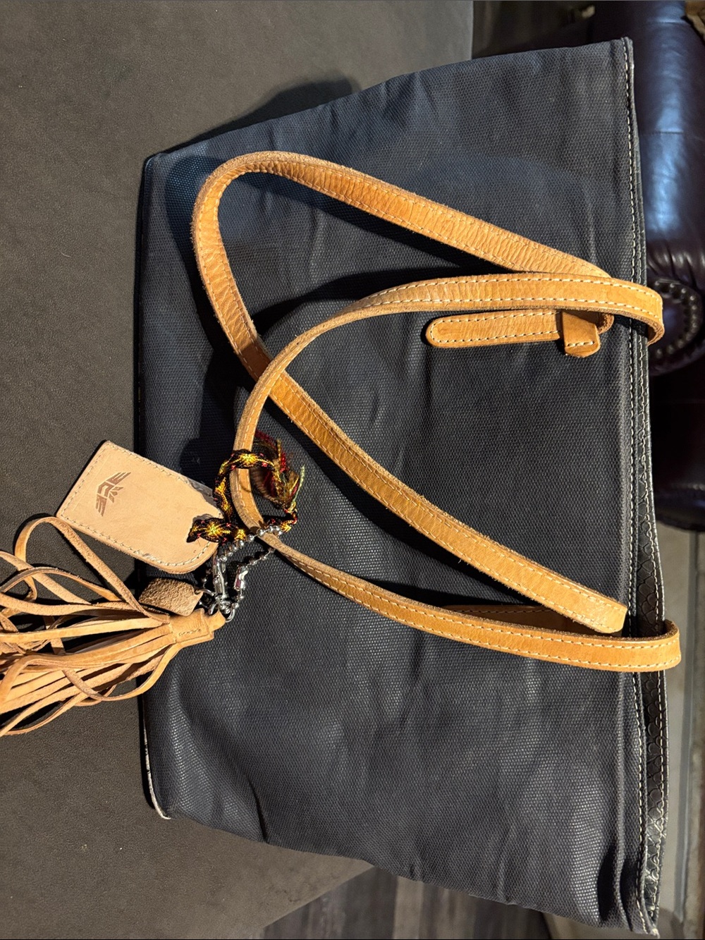 Consuela Black Shoulder Bag with Tan Leather Straps and Tassel